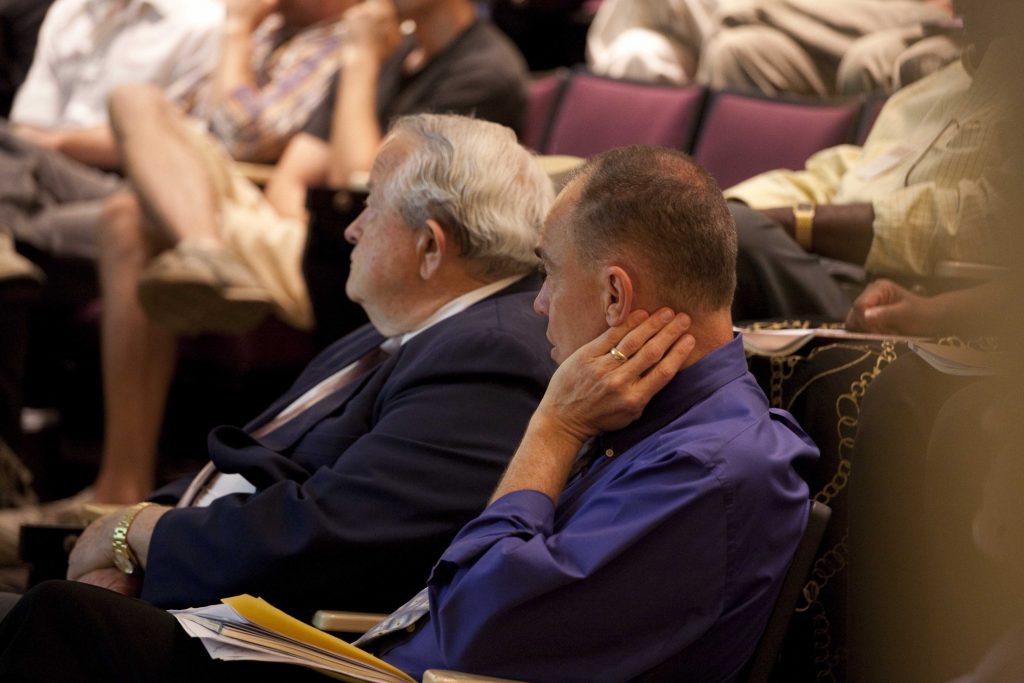 David Fleer and Tom Olbricht listening to a speaker at the 2010 Christian Scholars' Conference